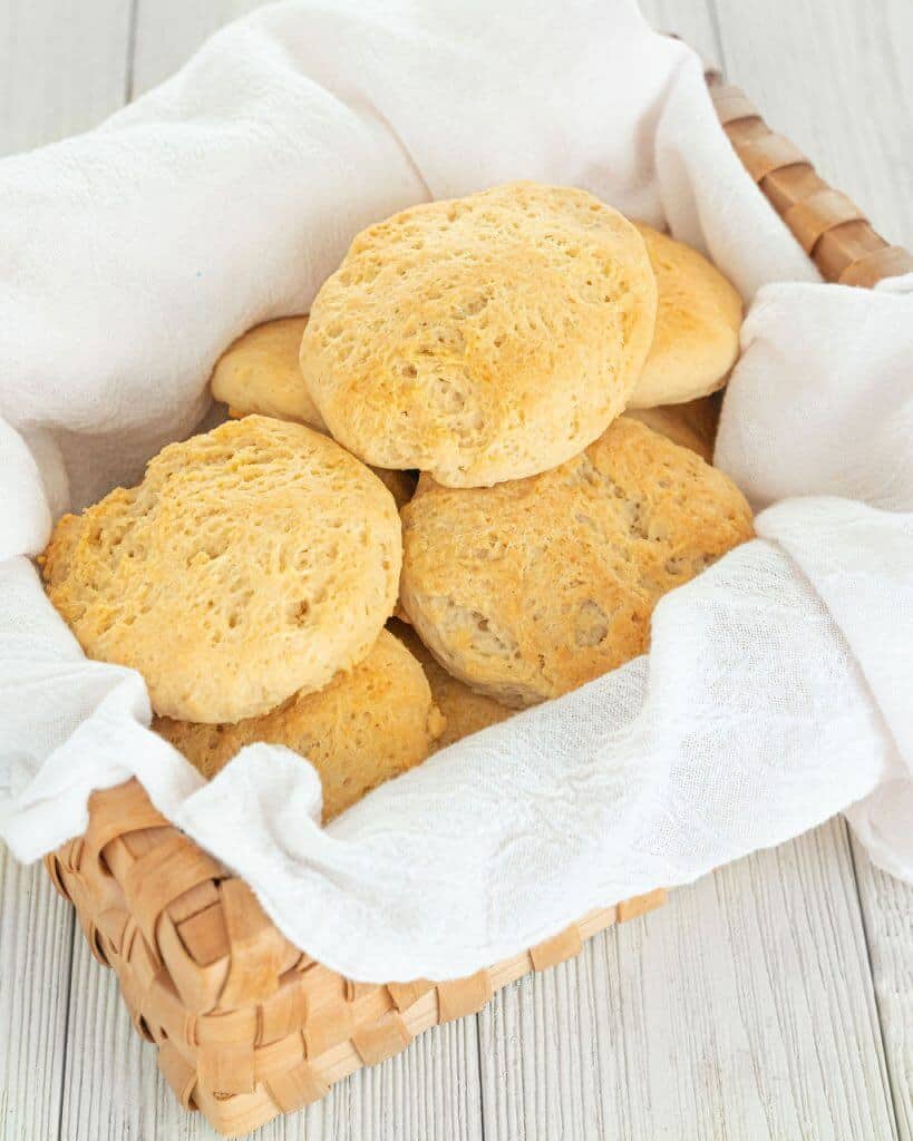 A towel-lined basket filled with dairy-free biscuits.