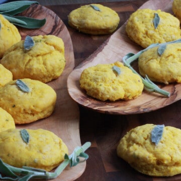 Butternut squash biscuits with a sage leaf pressed into the top of each one.