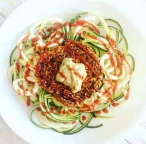 Vegan bean burger on a bed of zoodles.