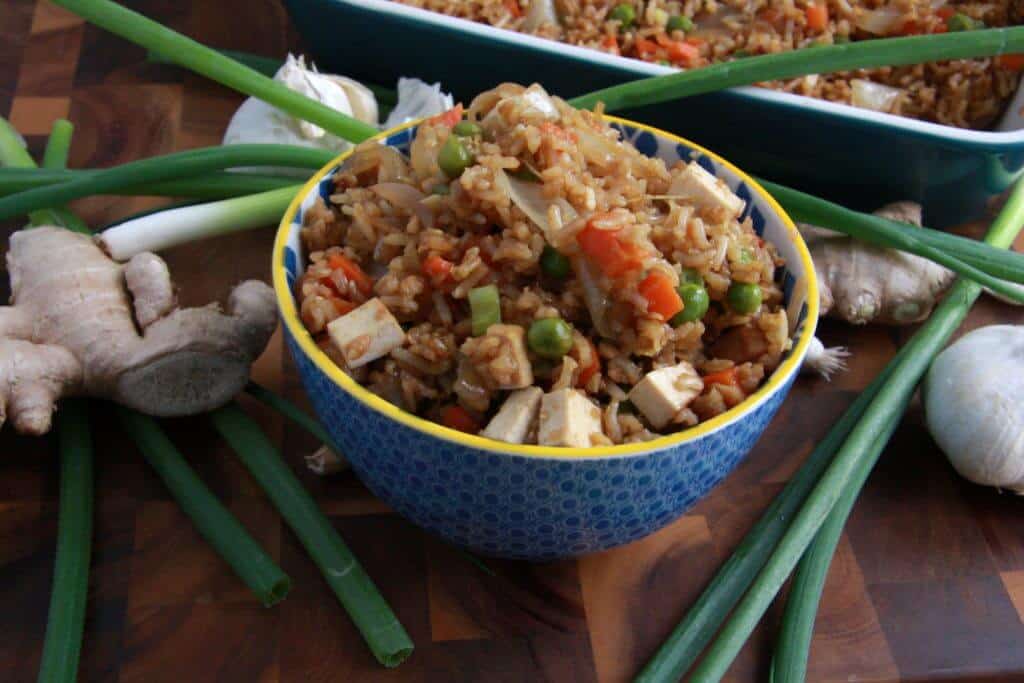 Vegan veggie fried rice in a small blue bowl.