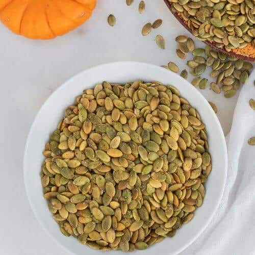 Roasted Pepper Pumpkin seeds in a large white serving bowl.