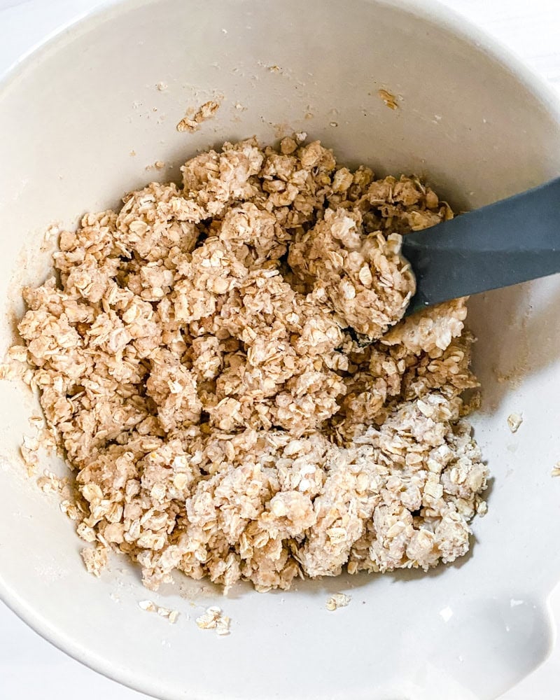 Process shot showing mixing ingredients in a bowl.