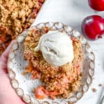Completed Vegan Plum Crisp piece on a plate.