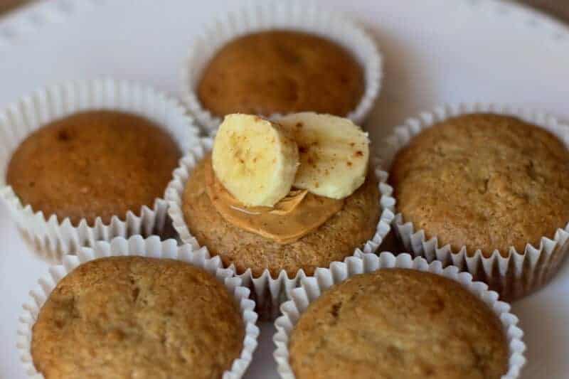 Easy vegan oil-free banana muffins on a white background.