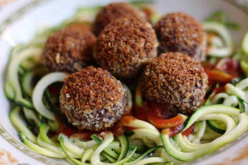Black bean meatballs on a bed of zoodles.