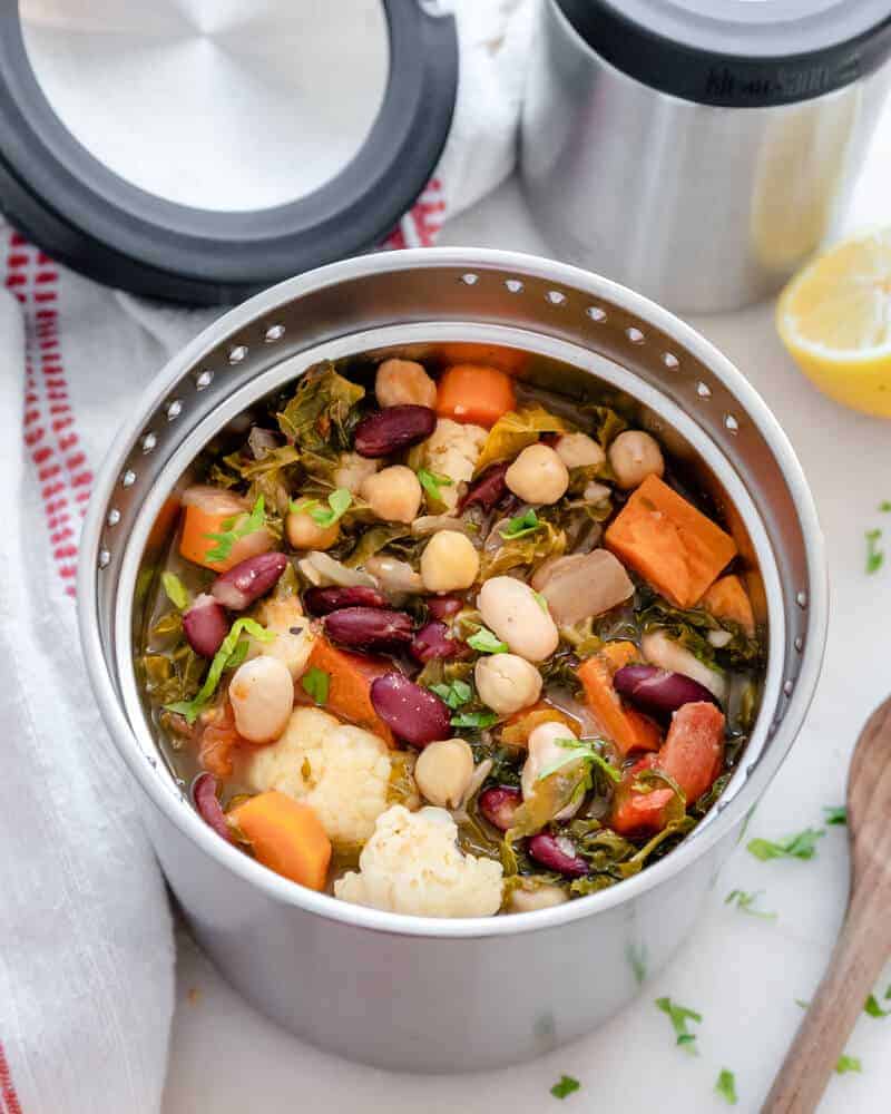 Kale and bean soup in a thermos container.