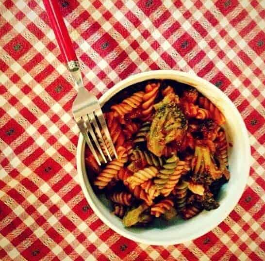 The cheapest veggie pasta (and delicious!) in a bowl with a fork.