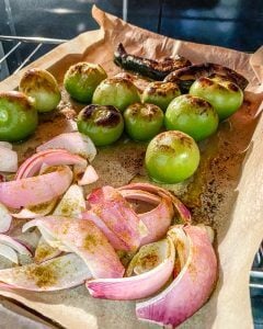 process of showing roasted tomatillos and ingredients post baking