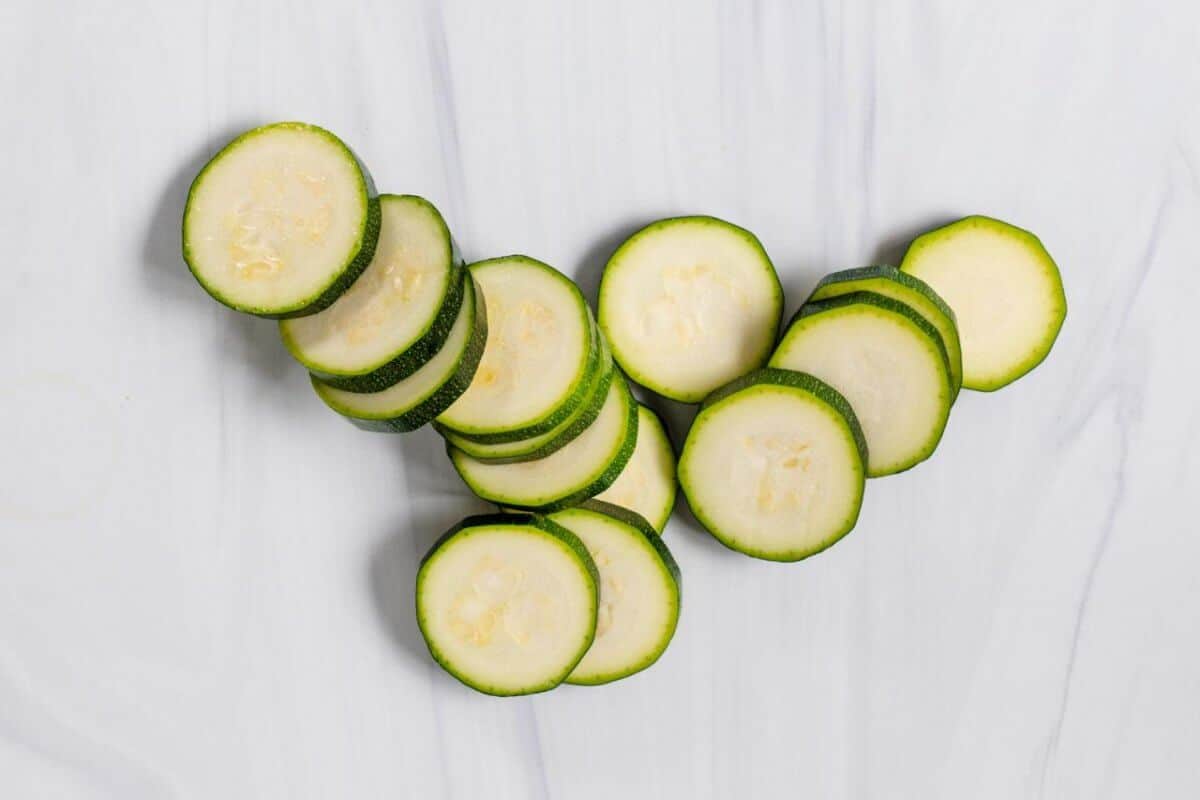 The Basics of Cutting Sliced Zucchini on a Marble Surface