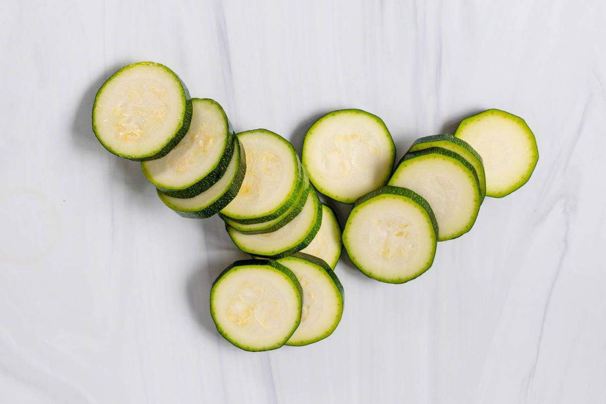 Sliced Zucchini on a Marble Surface