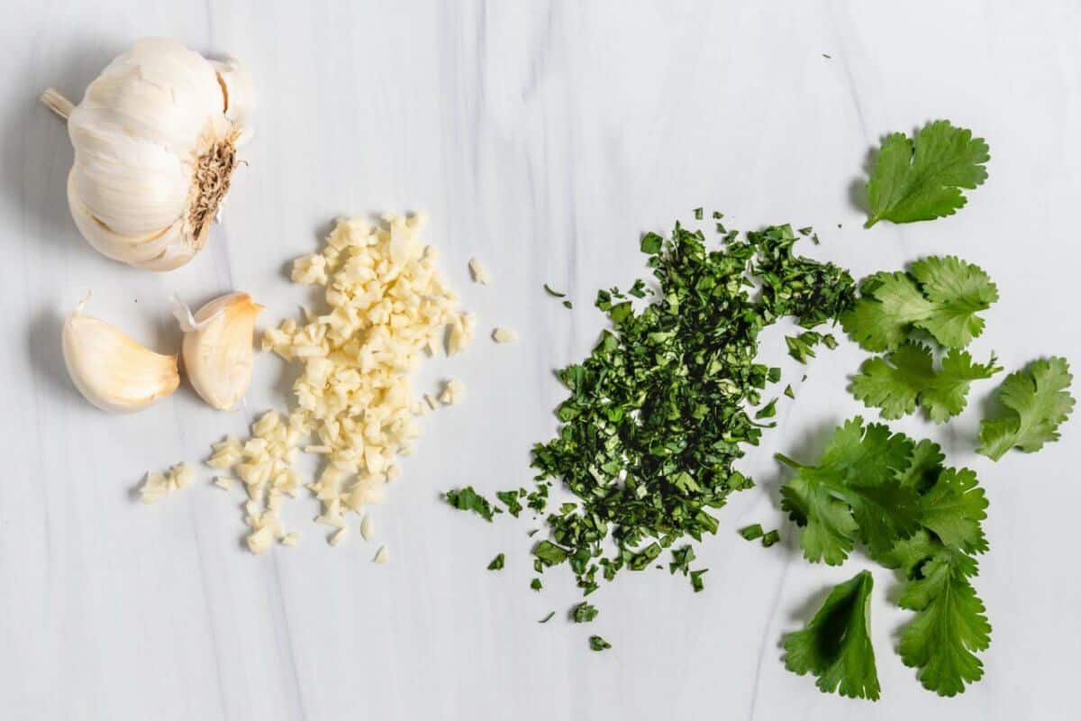 The Basics of Cutting Minced Garlic & Parsley on a Marble Surface