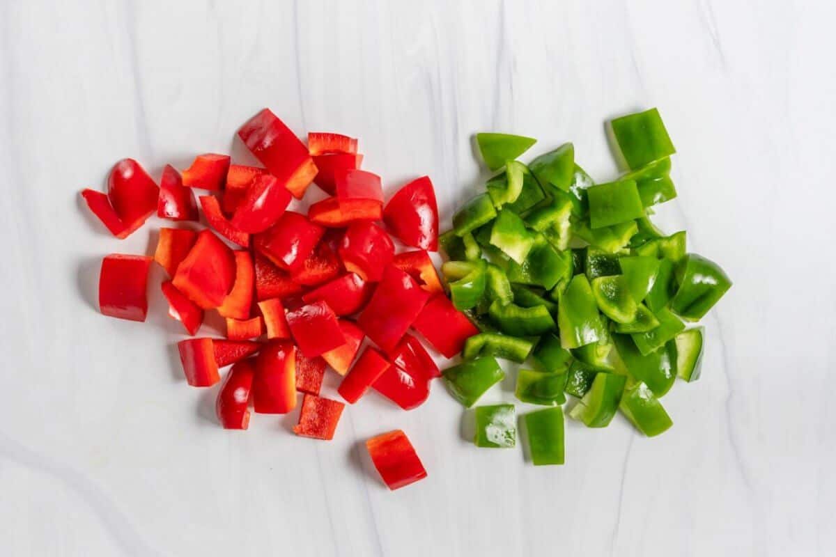 The Basics of Cutting Chopped Red and Green Bell Pepper on a Marble Surface