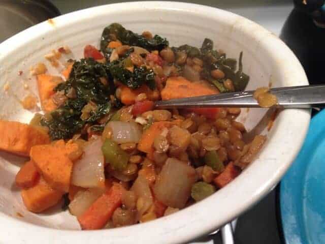 Dinner bowl of lentils with kale and yam.