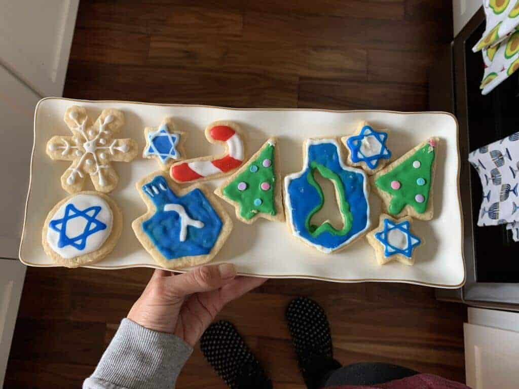 Vegan cut out sugar cookies in Christmas and Hanukkah shapes.