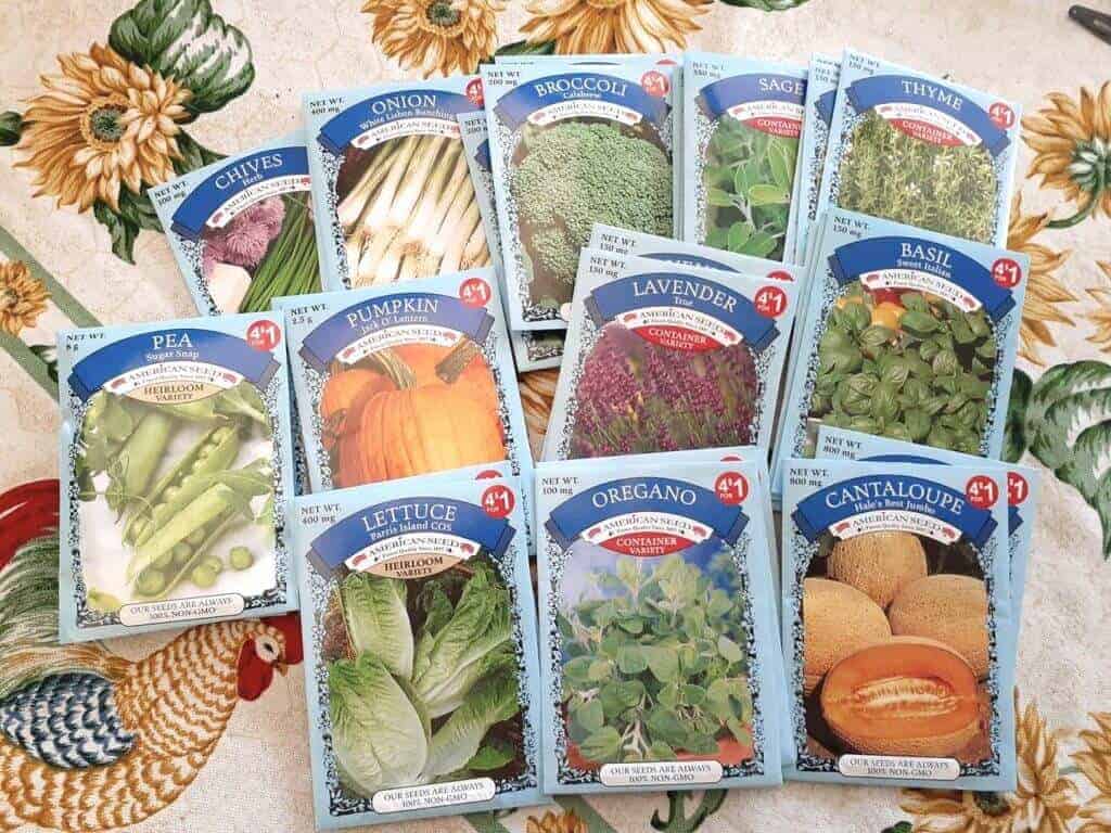 Various seed packs spread out on a table.