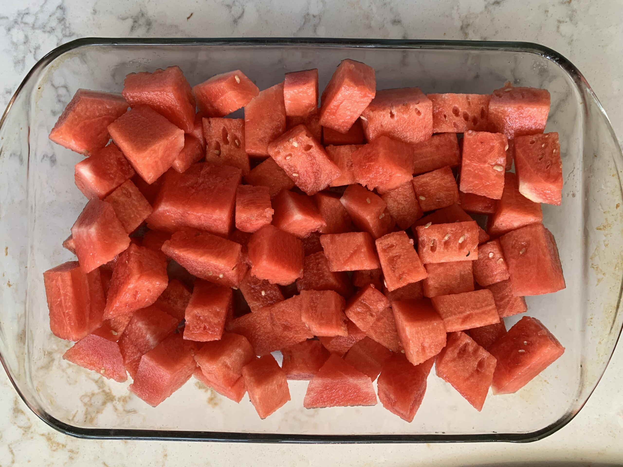 sliced watermelon in baking dish