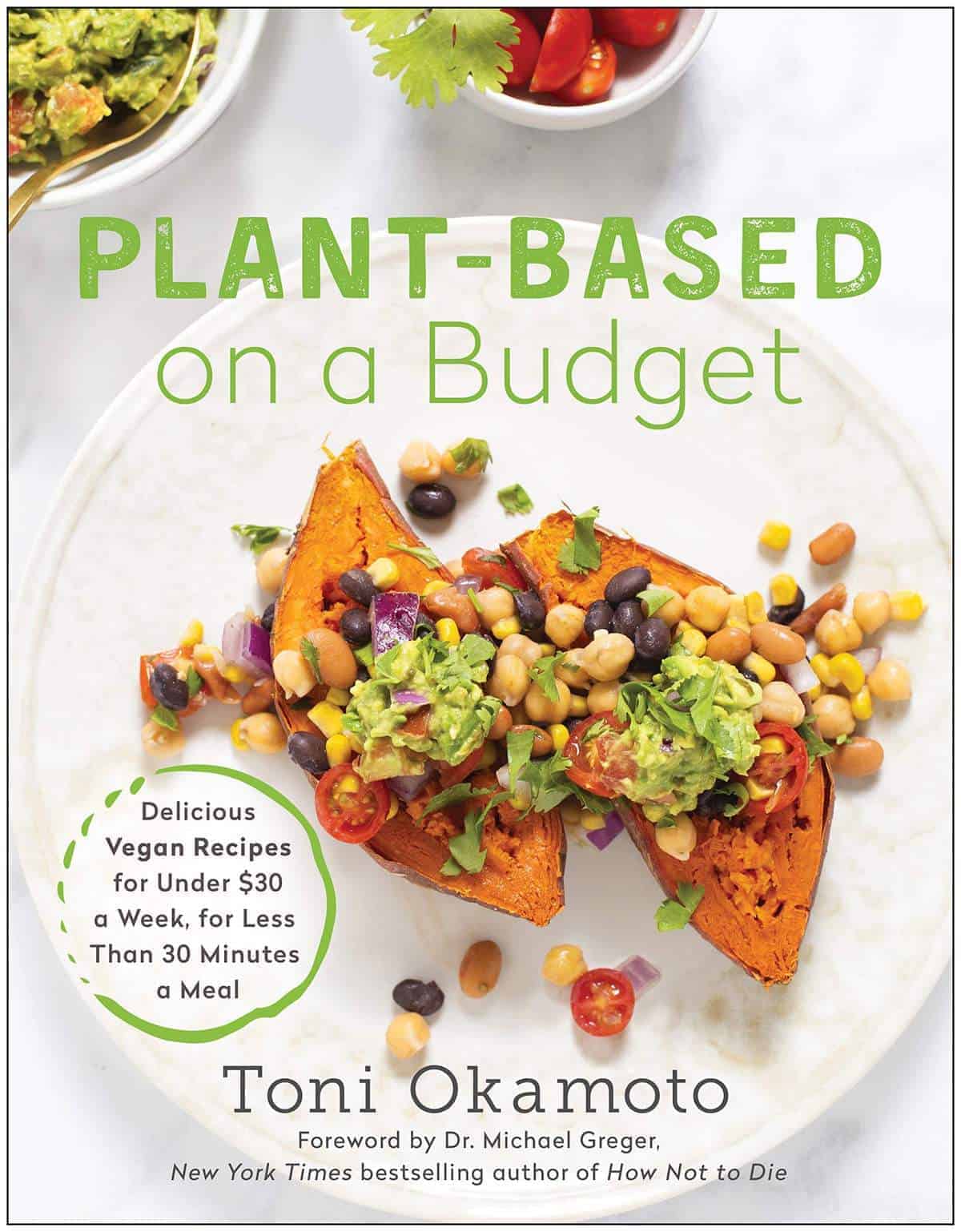 Plant Based on a Budget Book Cover. The top of the book says "Plant Based on a Budget" in green and below it has a photo of open-face cooked sweet potato topped with beans, corn, tomatoes, and guacamole.