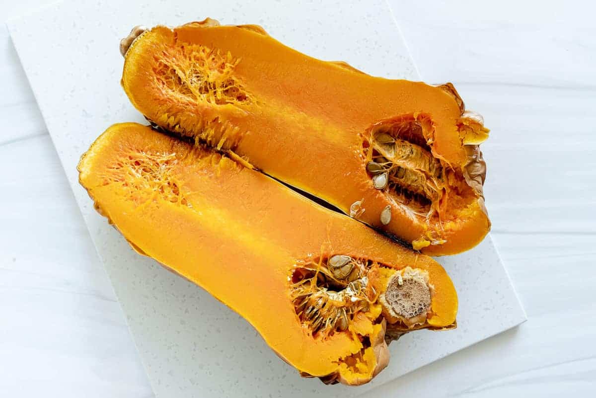 butternut squash roasted against white surface