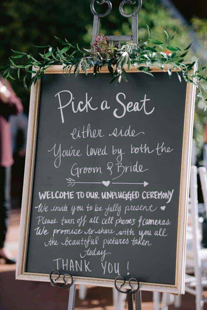 Pick a Seat sign at a wedding.