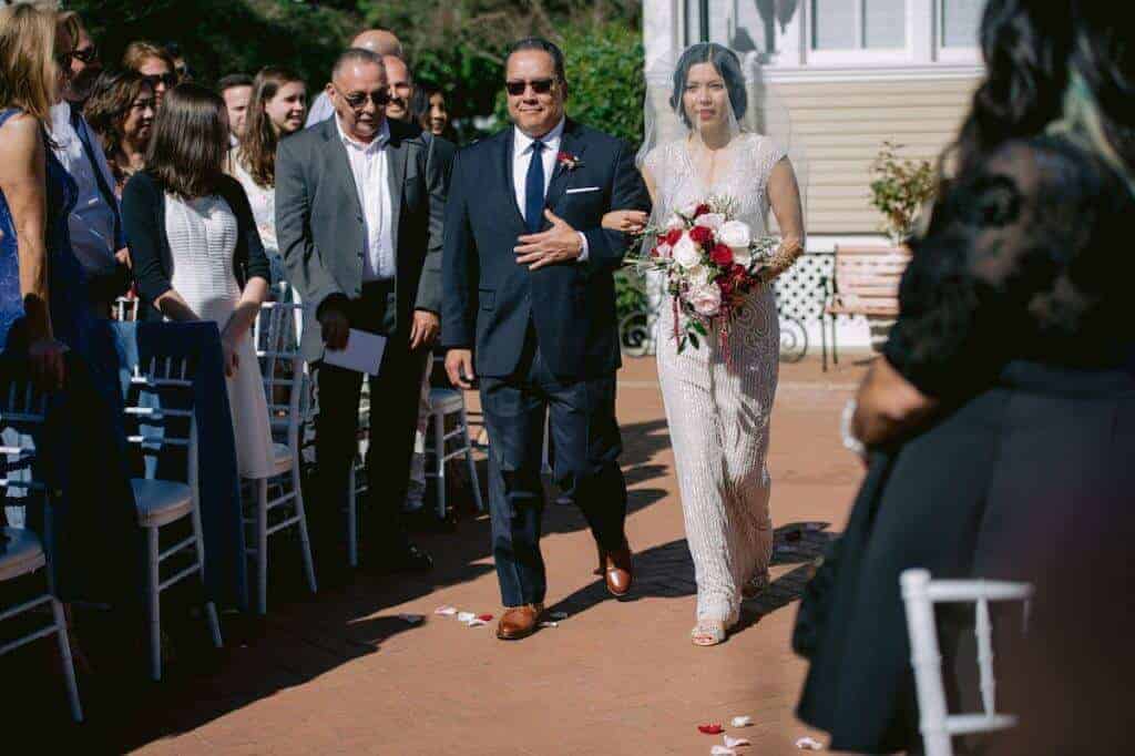Father walking the bride down the aisle.