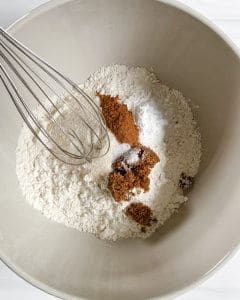 Dry ingredients of Apple Cinnamon Waffles in white bowl