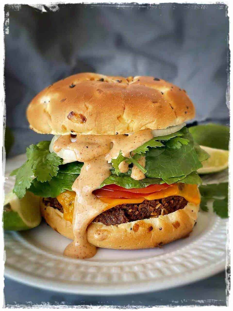 Vegan Chorizo Burger on a white plate in a gray background