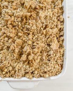 plum crisp in white container with a white background