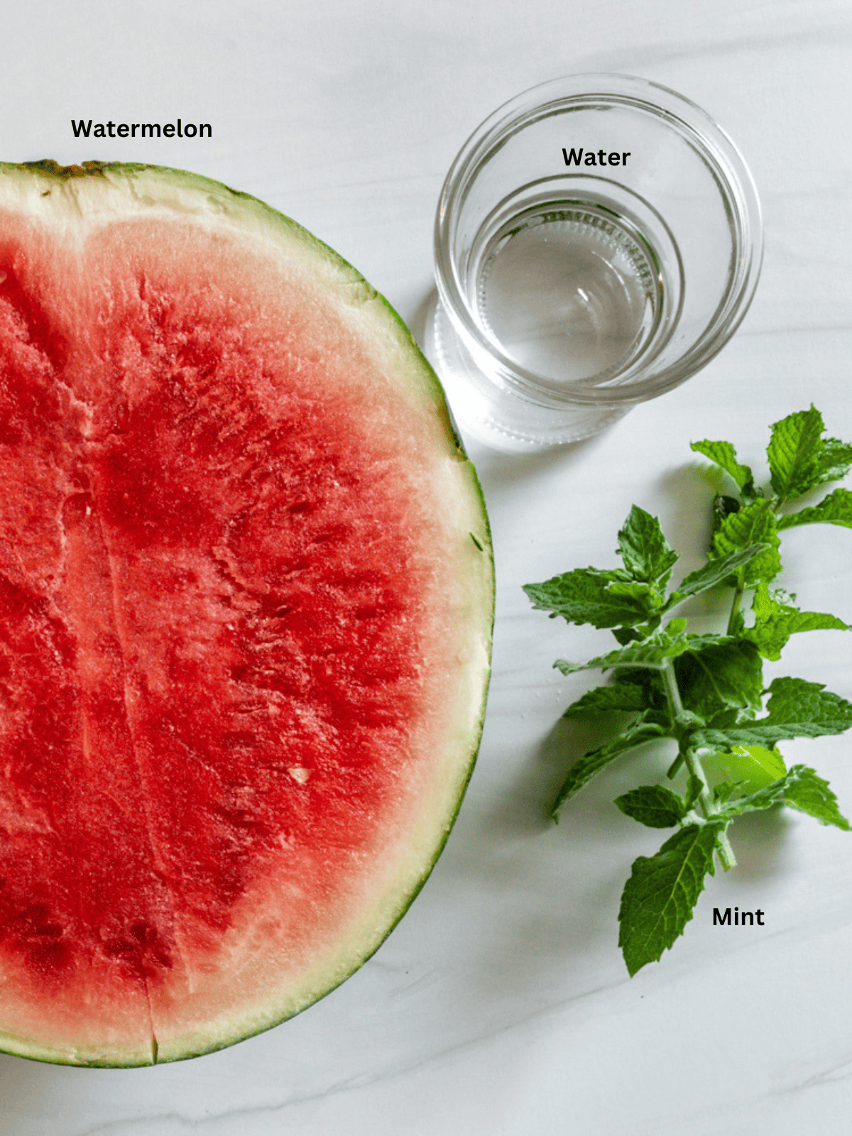 ingredients for Watermelon Slushie measured out on a white surface