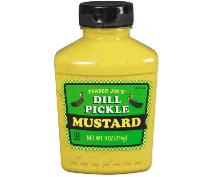 dill pickle mustard in jar against white background