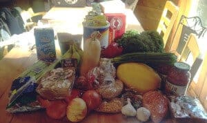 Photo of weekly groceries on a kitchen table.