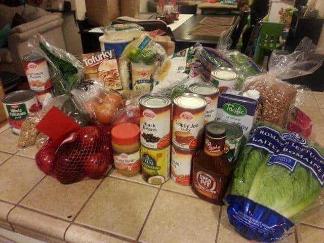 A week's worth of groceries set out on the kitchen counter.