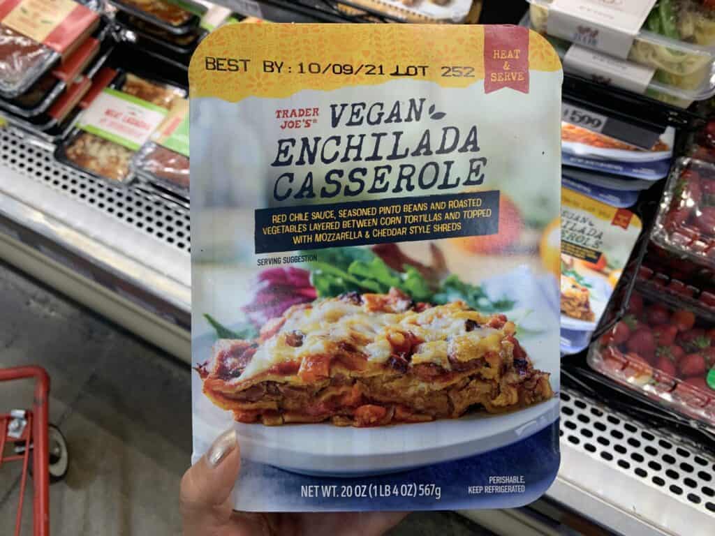 vegan enchilada casserole in package at the store against a dark background