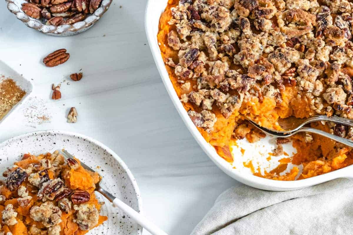 Candied Sweet potatoes in baking dish and plated against white background
