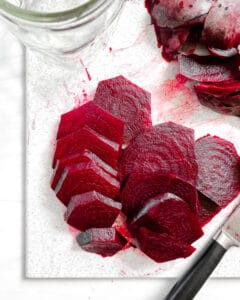 sliced beets against a white background