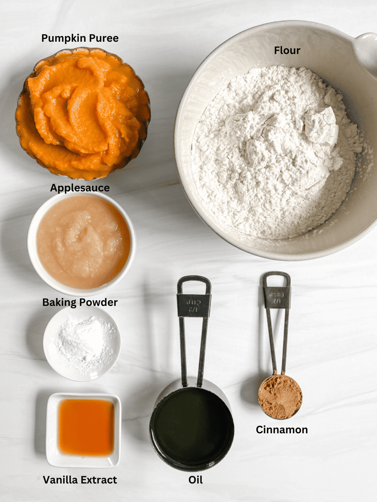 ingredients for Vegan Pumpkin Bread measured out on a white surface