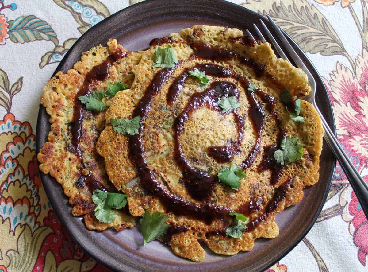 Chickpea flour pancakes on a large plate.