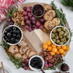 completed Christmas Wreath Charcuterie Board with several ingredients against a white background
