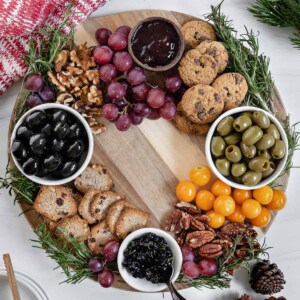 completed Christmas Wreath Charcuterie Board with several ingredients against a white background