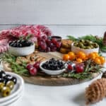 completed Christmas Wreath Charcuterie Board with several ingredients against a white background