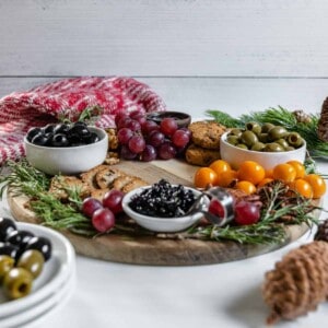 completed Christmas Wreath Charcuterie Board with several ingredients against a white background