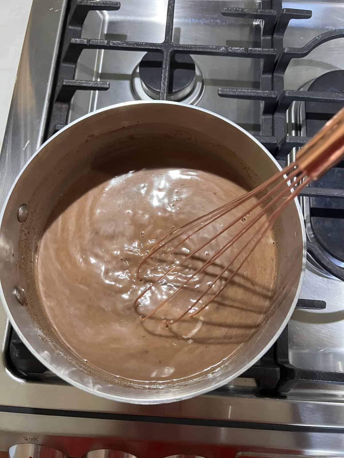 process of mixing mexican hot chocolate in pan 