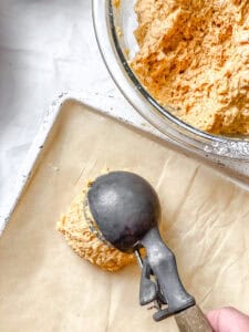 process shot showing adding batter to baking sheet