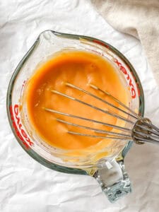 process shot showing whisking ingredients in container