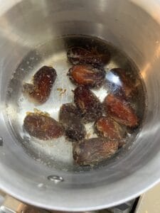 process of boiling dates in pan