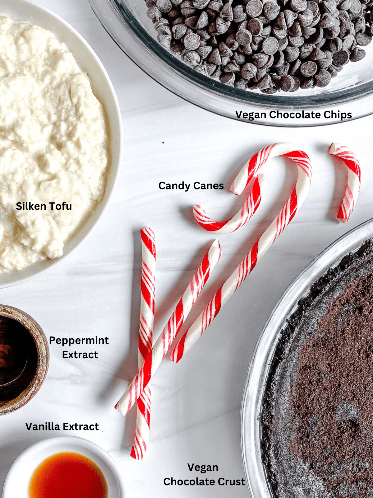 ingredients for Silken Chocolate Peppermint Pie measured out on a white surface