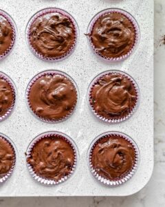 process of Blackberry Chocolate Cupcakes pre oven in muffin tin