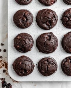 completed Blackberry Chocolate Cupcakes without icing on top in muffin tin