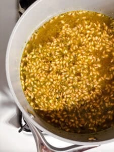 process shot showing farro cooking in pot
