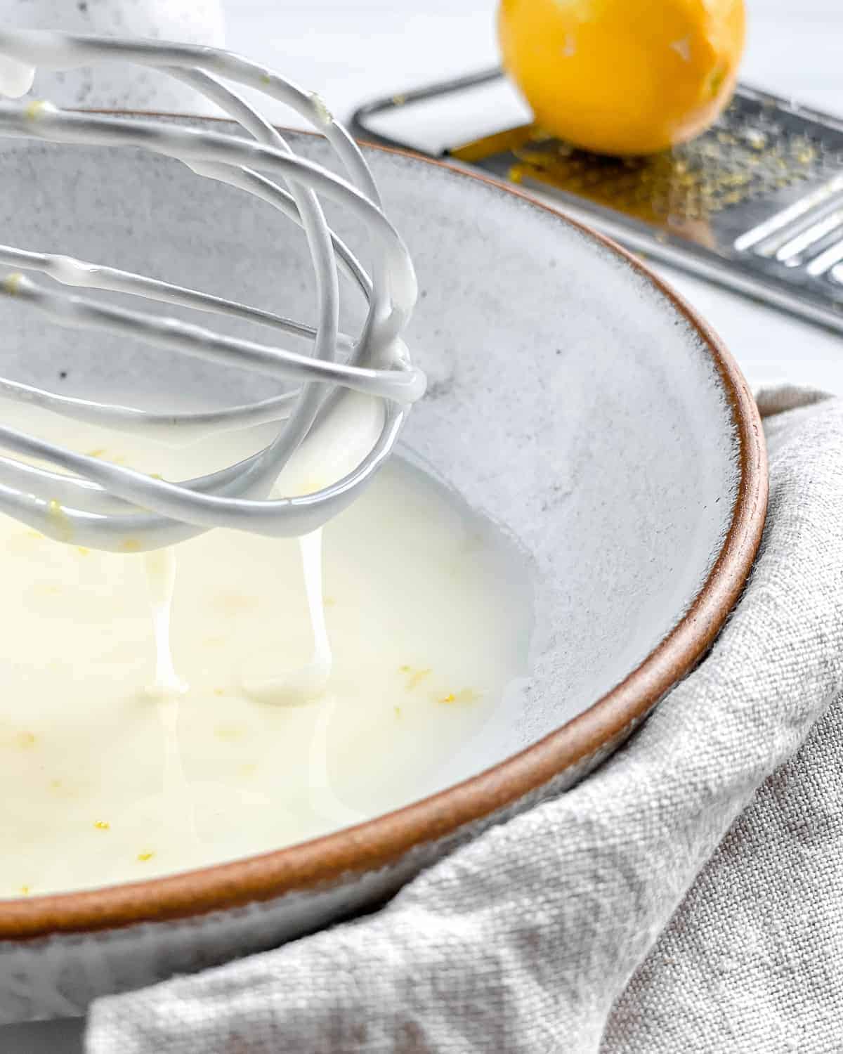 process of mixing lemon glaze ingredients together