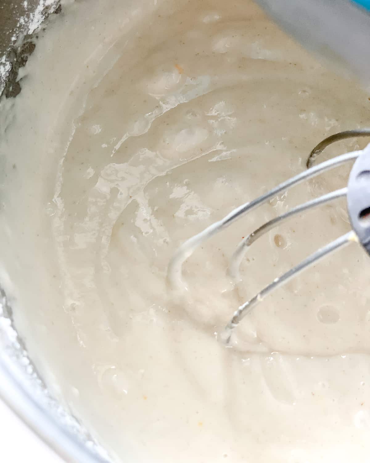 process of mixing batter for lemon loaf